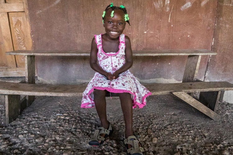 Haitian Girl in Shoes That Grow